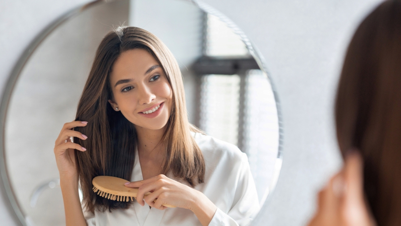 beautiful lady combing her hair